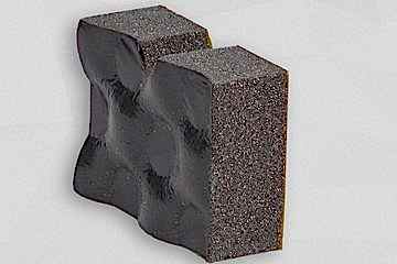 Dunkelgraue Schaumstoffplatte stehend mit schwarzer Folienoberfläche